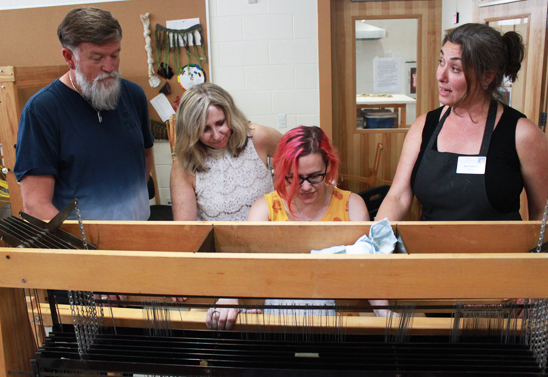 Amy Putansu teaching weaving to students at Haywood Community College, 2017. Photo by Jessica Duque.